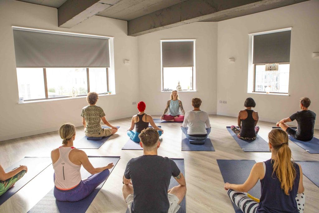 group of people enjoying a Hatha Yoga class in Hove